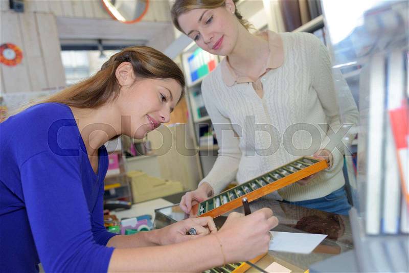 Young woman painter at a drawing class, stock photo