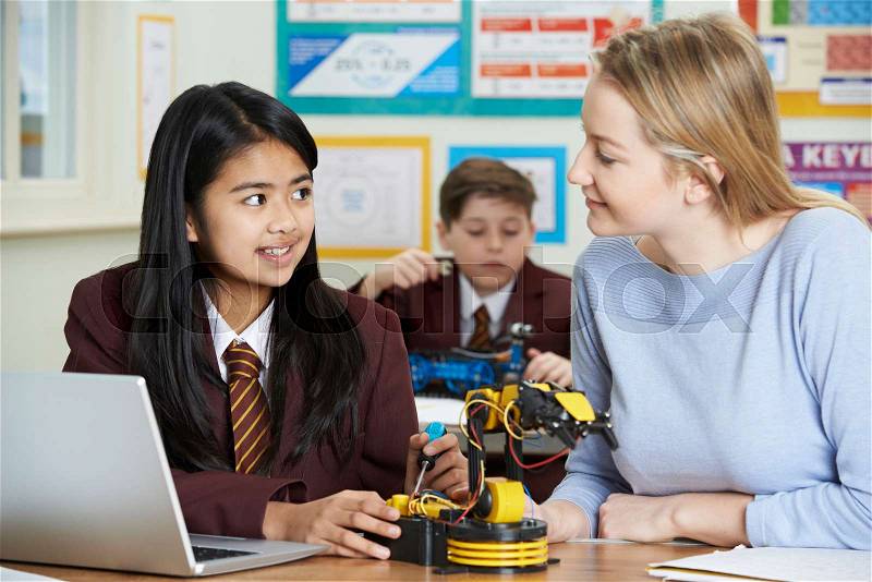 Teacher With Pupils In Science Lesson Studying Robotics, stock photo