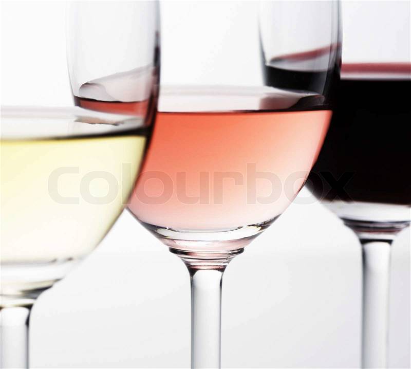 Red, rose and white wine in a wine glasses, stock photo