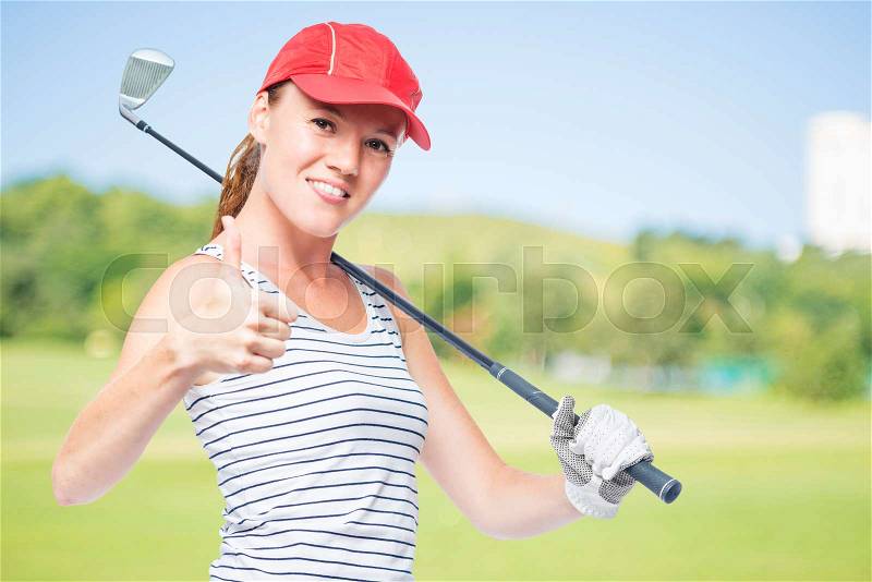 Golfer young and successful with golf club on a background of golf courses, right space, stock photo