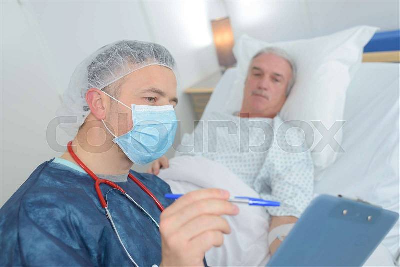 Female doctor reassuring patient with test results, stock photo