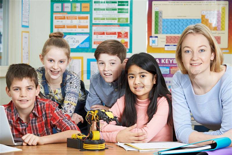 Pupils And Teacher In Science Lesson Studying Robotics, stock photo