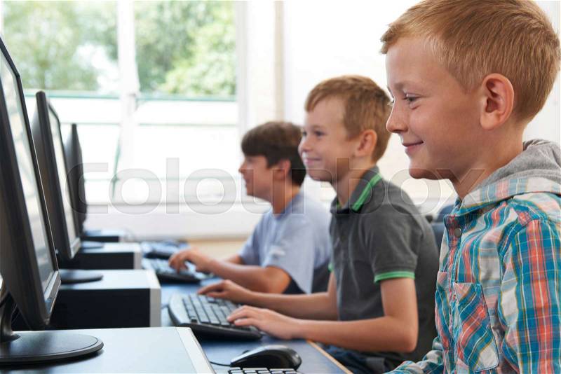 Group Of Male Elementary School Children In Computer Class, stock photo