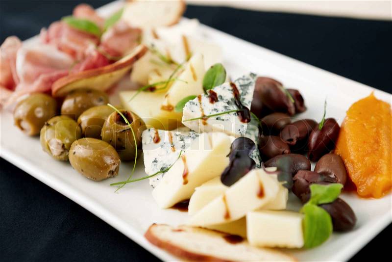 Snacks selection for wines Parma ham, olives, cheese, stock photo