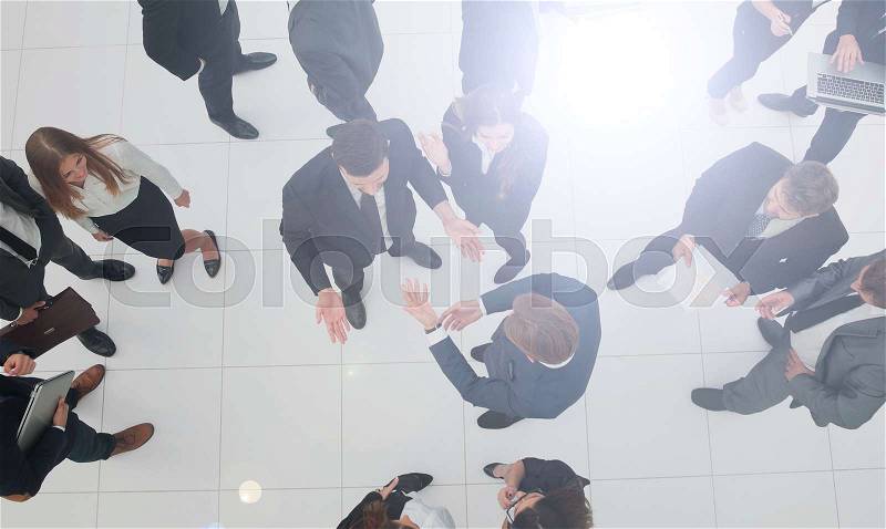 Elevated view of large group of multiethnic business people talk, stock photo
