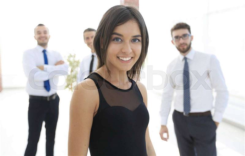 Young employee of the company on the business background of the team.creative youth people, stock photo