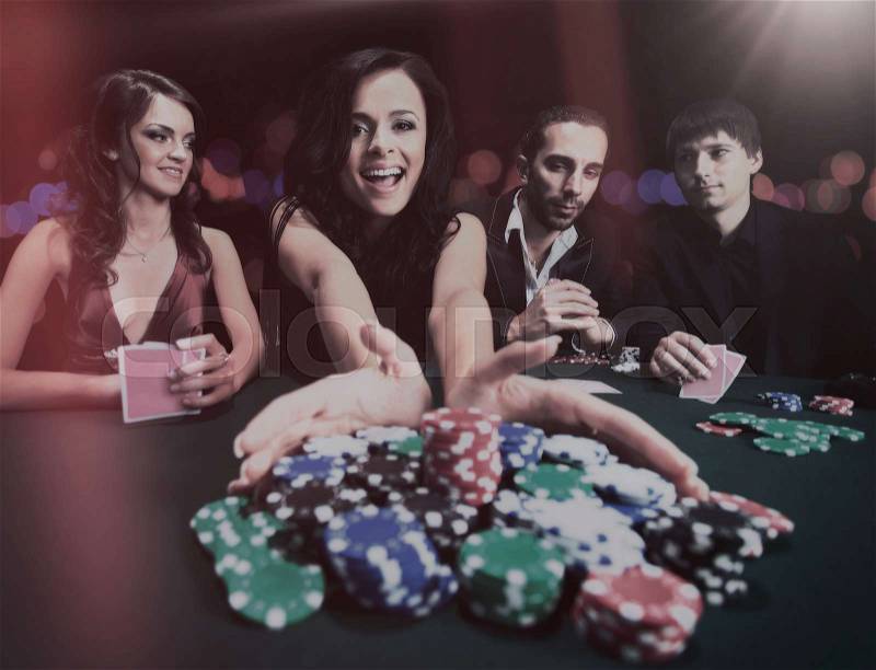 Young beautiful woman playing in casino, stock photo