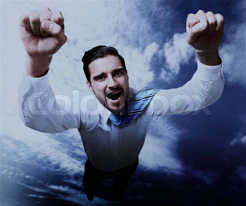 Happy businessman flying in the sky, stock photo