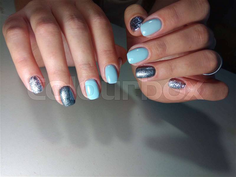 Perfect manicure and natural nails. Attractive modern nail art design. Gel polish applied, stock photo