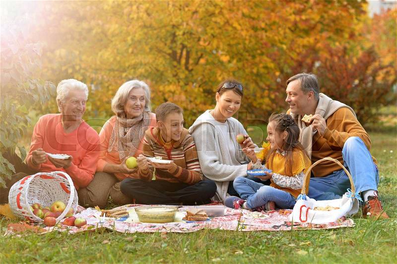 Big happy family on picnic in autumn, stock photo
