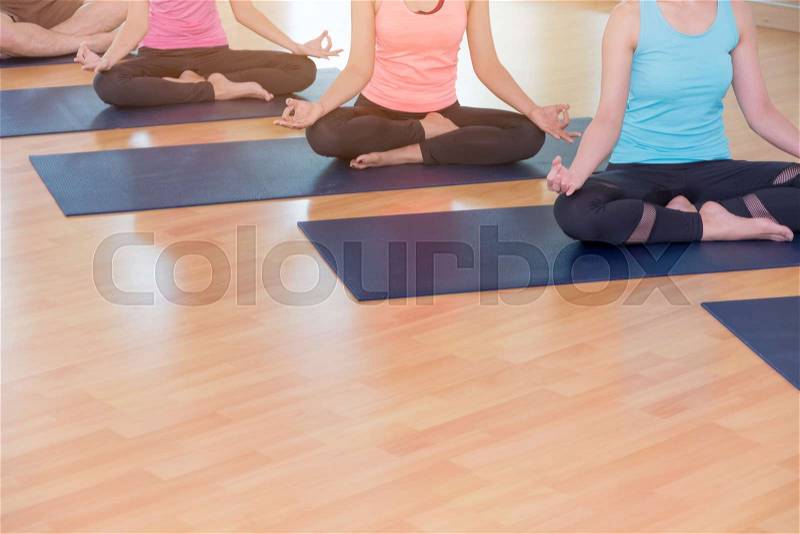 Yoga people doing lotus pose with clam relax emotion,Meditation pose,Wellness and Healthy Lifestyle training group class in studio room, stock photo