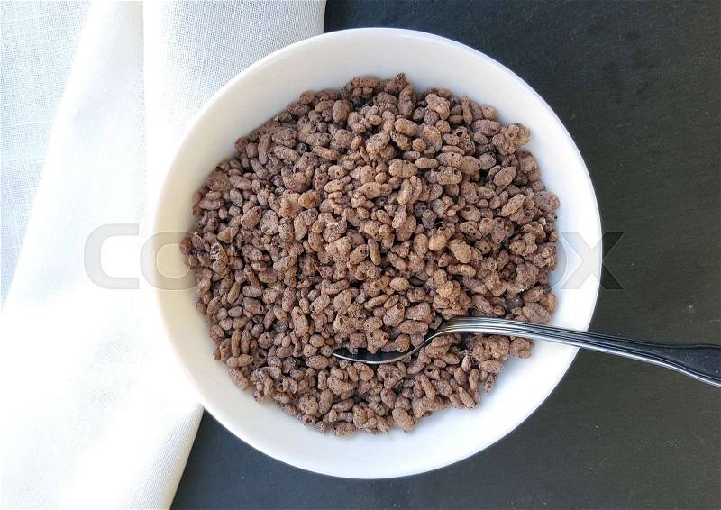Chocolate cereals in bowl, stock photo