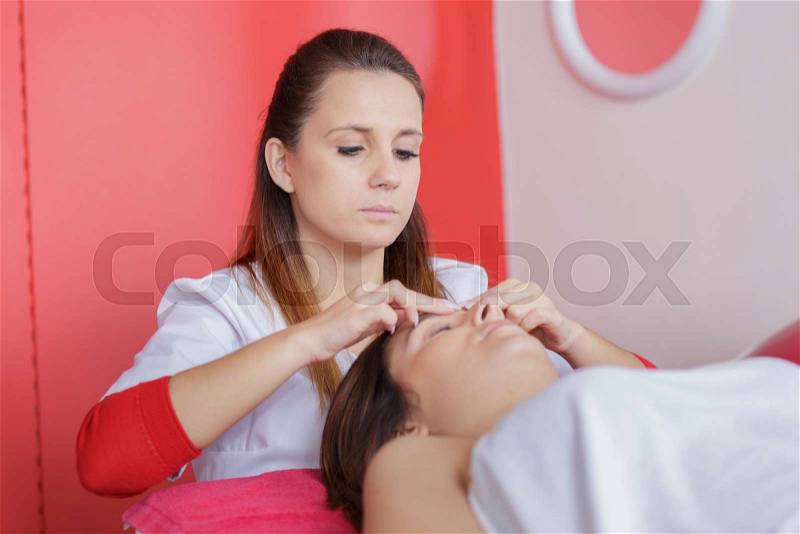 Picture of happy beautiful woman in massage salon, stock photo