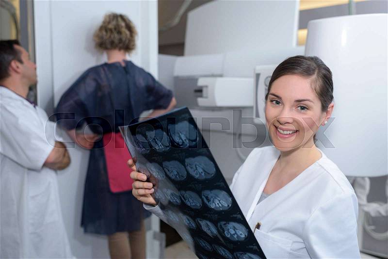 Xray technician holding the result, stock photo
