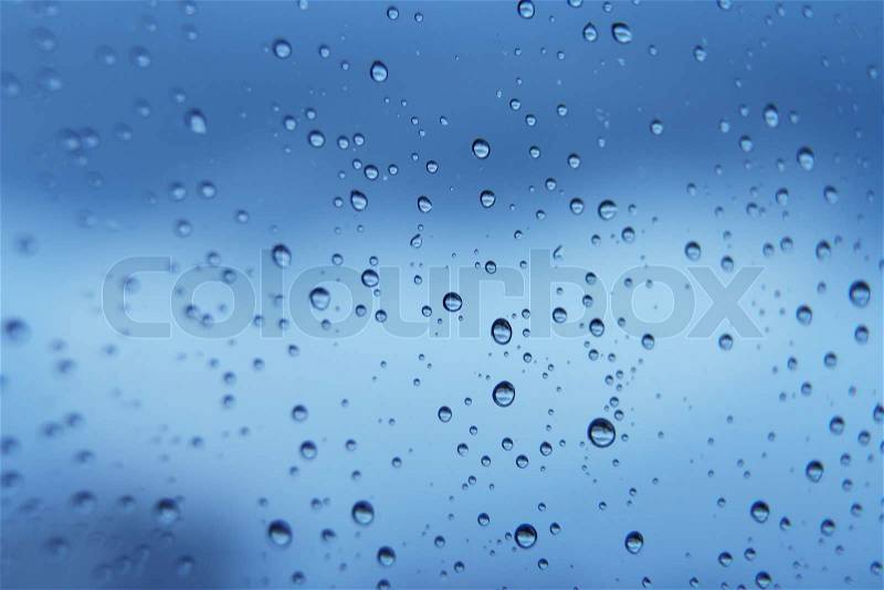 Blue water soft bubbles on the window for background, stock photo