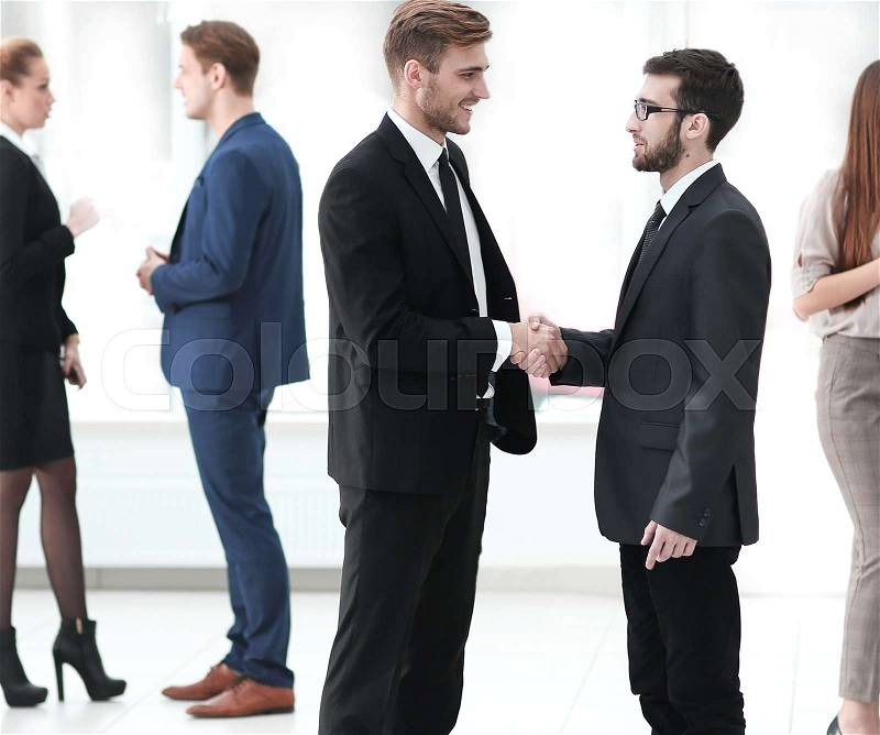 Handshake of the employees in the lobby of the office.photo with copy space, stock photo