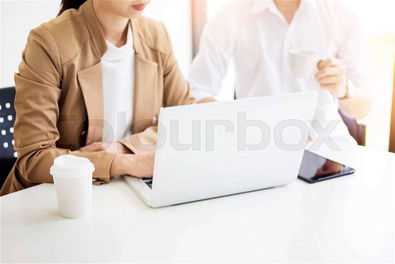 Team work process. young business managers crew working with new startup project. labtop on wood table, typing keyboard, texting message, analyze graph plans, stock photo