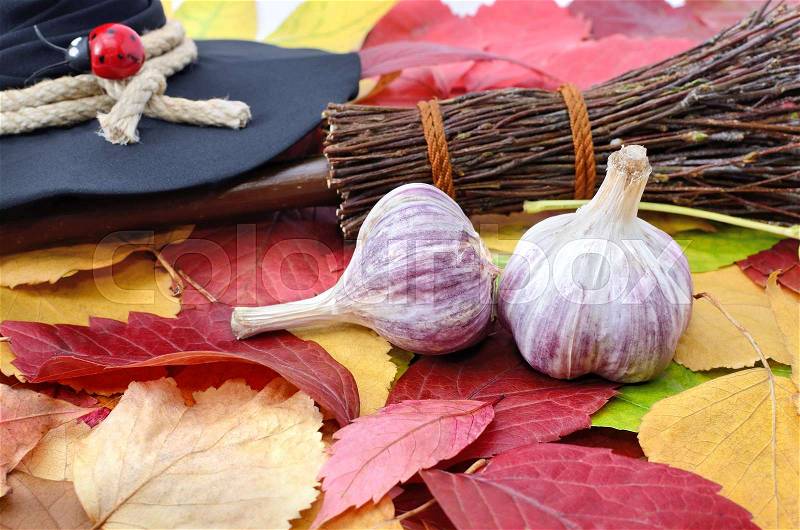 Garlic against the evil spirit on the autumn leaves, stock photo