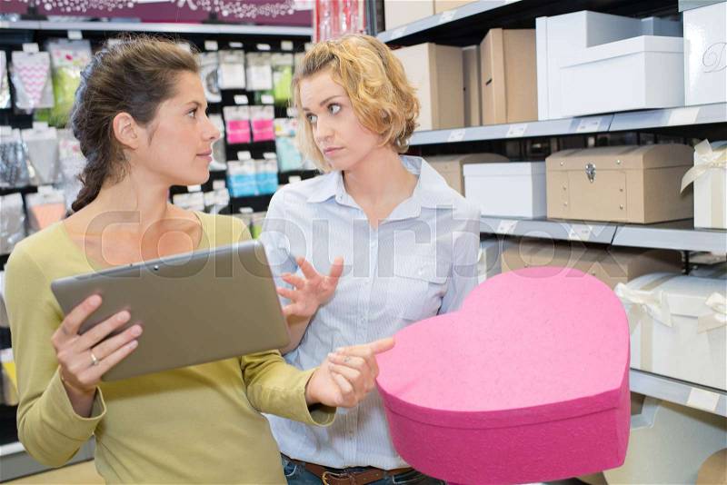 Cheerful women in stationary shop, stock photo