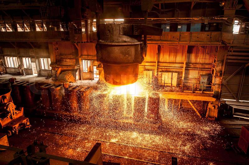 Tank pours the liquid steel in the forms, stock photo