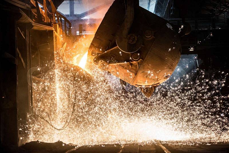 Pouring of liquid metal in open-hearth furnace, stock photo
