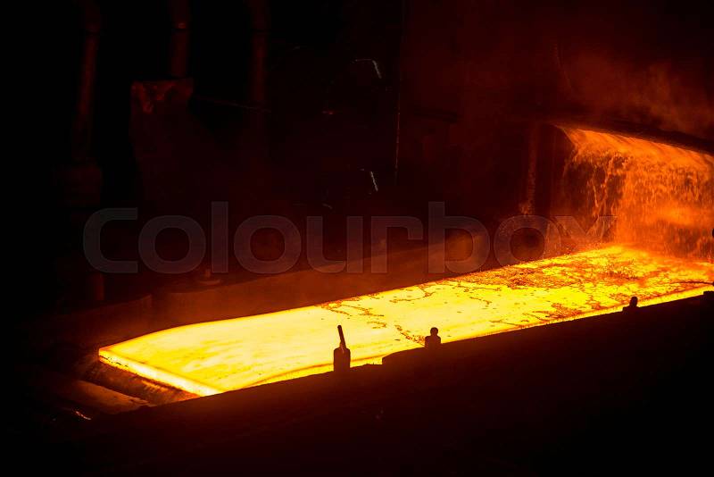 Sheet of hot metal on the conveyor belt, stock photo