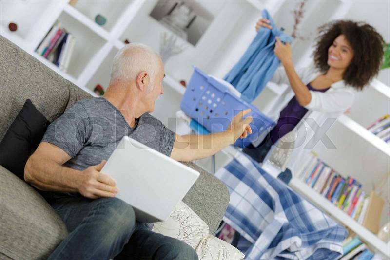 Community carer visiting patient at home, stock photo