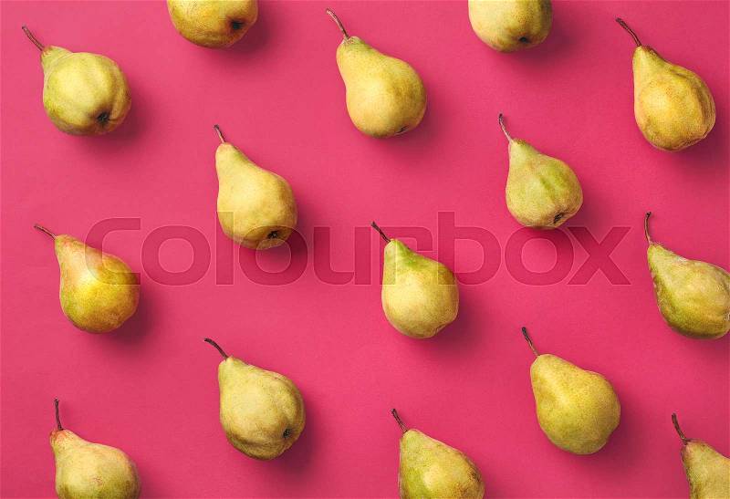 Colorful fruit pattern of fresh pears on pink background. From top view, stock photo
