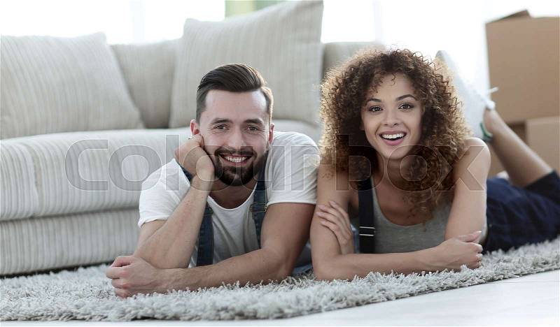 Happy couple in a new apartment. Family happiness and new housing, stock photo