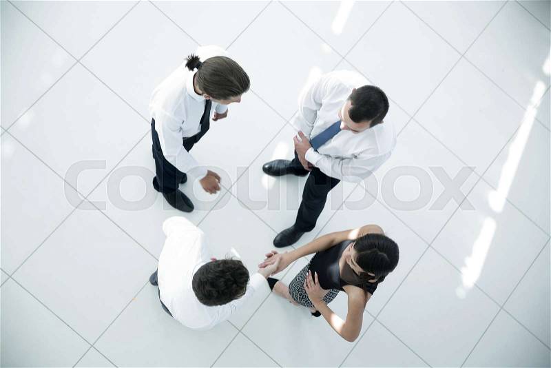 View from the top.welcome colleagues shaking hands in office lobby.photo with copy space, stock photo