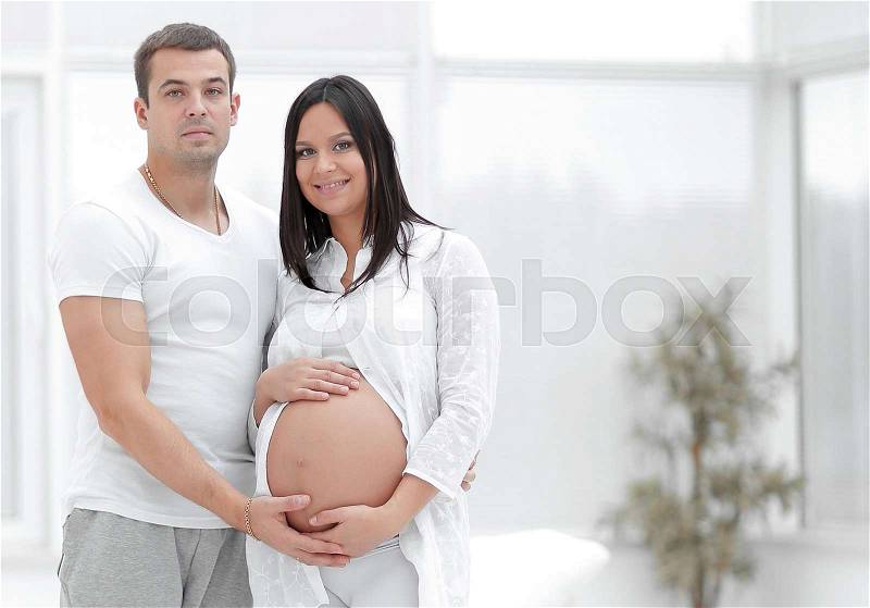 Happy pregnant couple in a new house in a new housing.photo with copy space, stock photo
