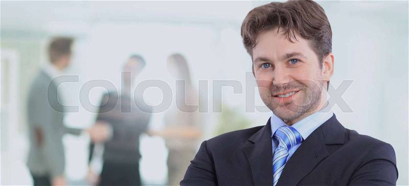 Happy mature business man looking at camera with satisfaction at office, stock photo