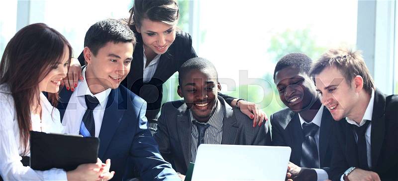 Happy working business team in modern office, stock photo