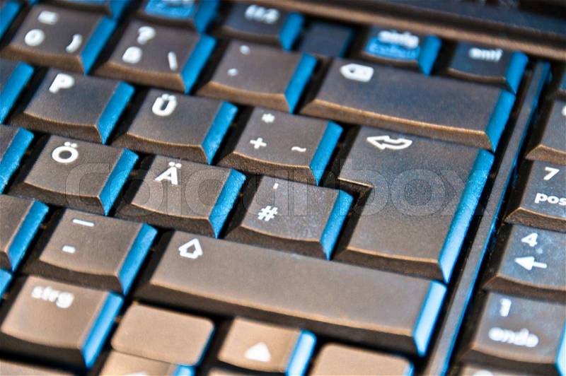 Closeup of laptop keyboard with focus on return key, stock photo