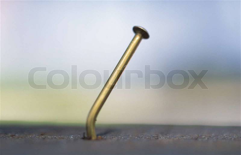 Nail in wood, stock photo