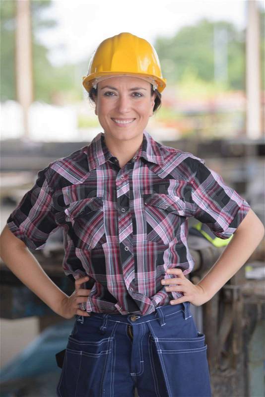 Female construction worker posing, stock photo
