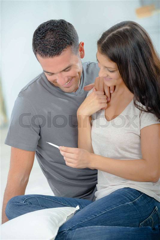 Happy couple finding out they are havning a baby, stock photo