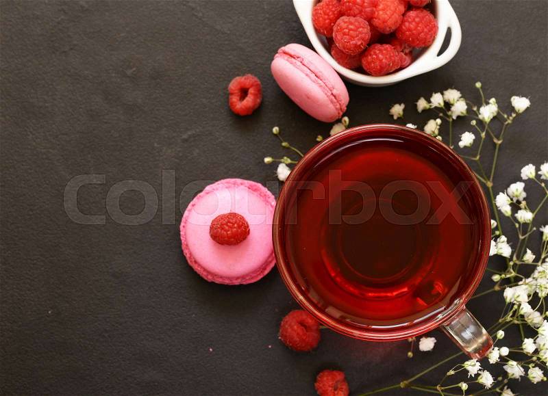 Berry red tea with raspberries and almond cookies, stock photo
