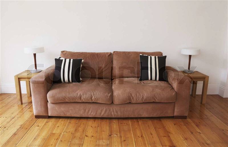 Empty living room with couch and end tables, stock photo