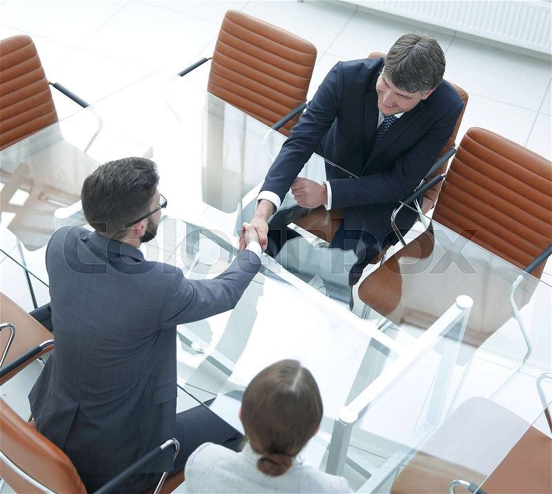 View from above . Handshake of financial partners after negotiations, stock photo