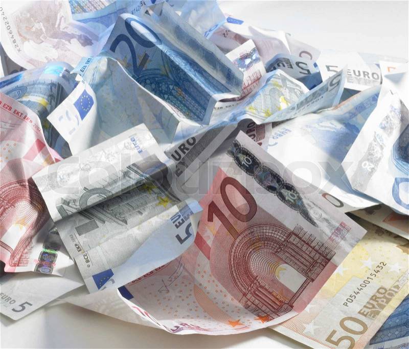 Studio photography with lots of crumbled euro banknotes in light back, stock photo