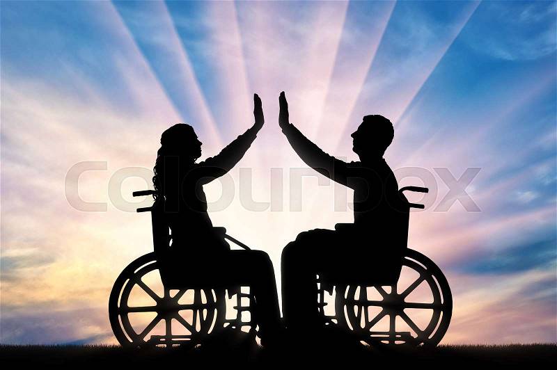 Silhouette of a woman and a man in a wheelchair, support each other. The concept of people with disabilities, stock photo