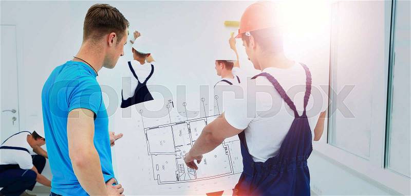 Architect and client discussing the plan of the building, stock photo