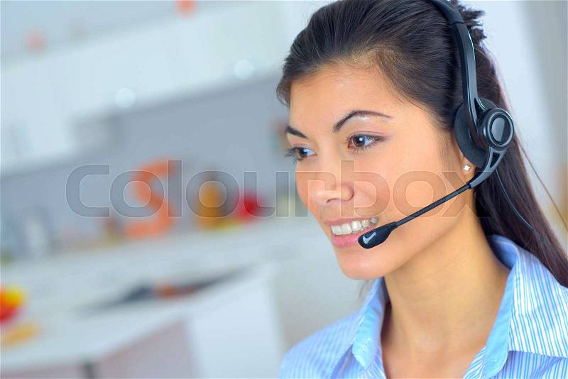 Female telephone sales worker, stock photo