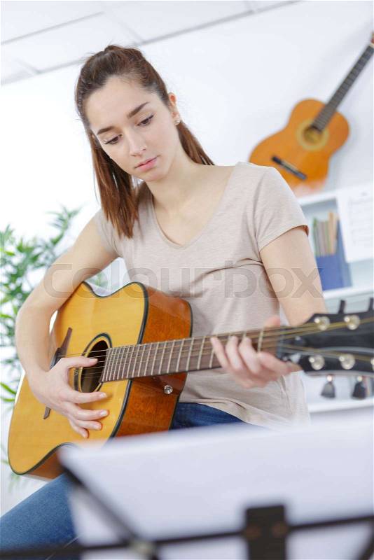 Teenager girl guitar play, stock photo