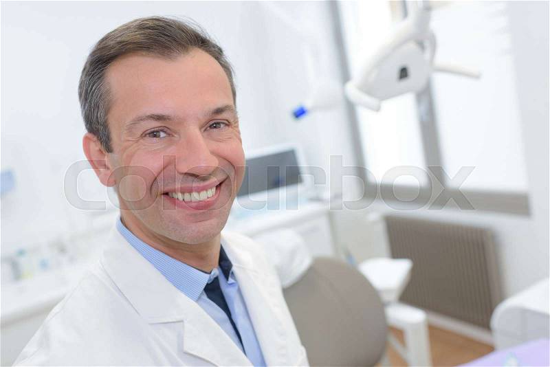 A smiling dentist, stock photo