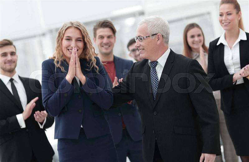 Happy business woman and senior business partner on the business background of the team, stock photo