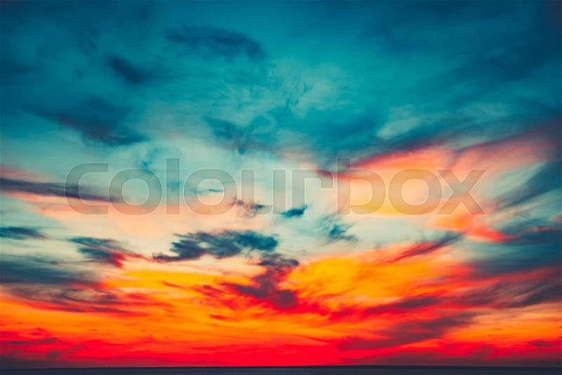 Sunset sky background. Natural Sunset Sunrise Over Ocean. Bright Dramatic Sky And Blue Water. Colorful Nature Landscape, stock photo