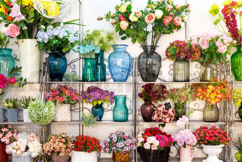 Flower shop, bouquets on shelf, florist business. Beautiful floral decoration, stock photo