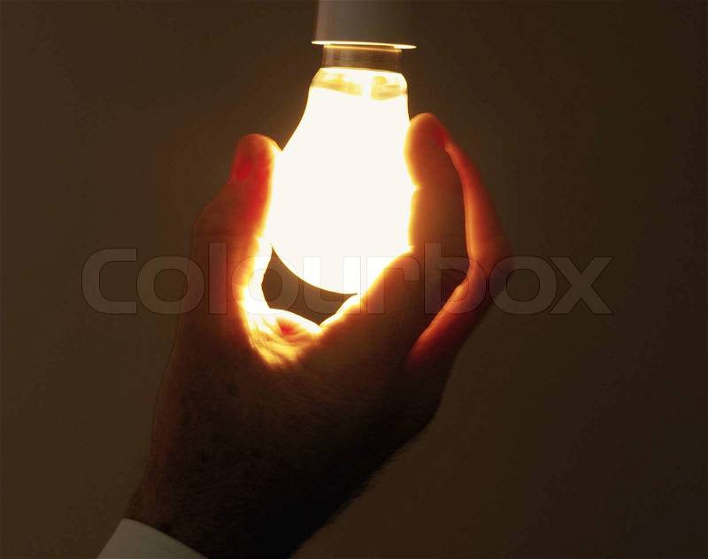 Lamp in hand, stock photo
